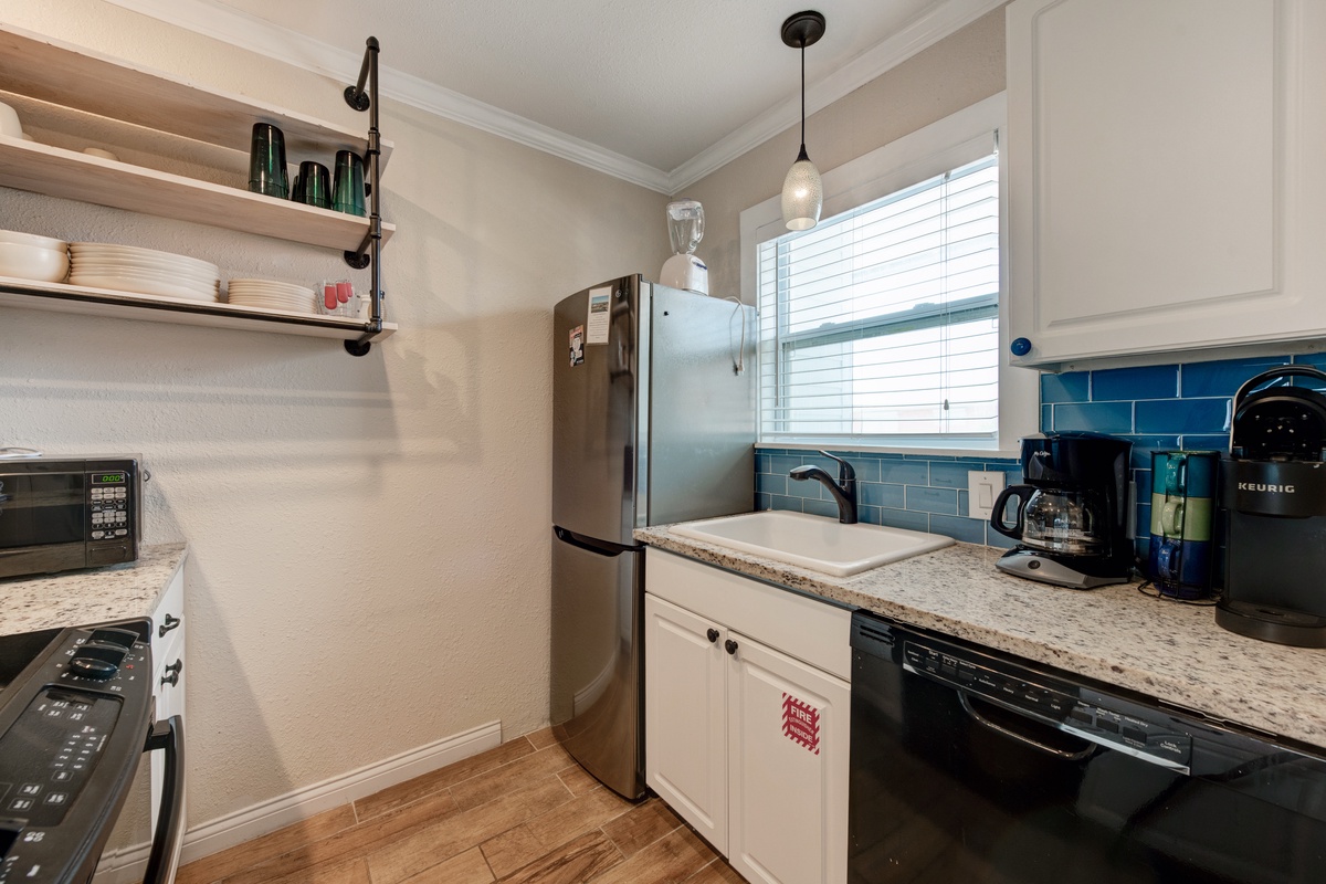 Your fully equipped kitchen has everything you need - stainless appliances, granite counters, and a cozy breakfast nook by the window.