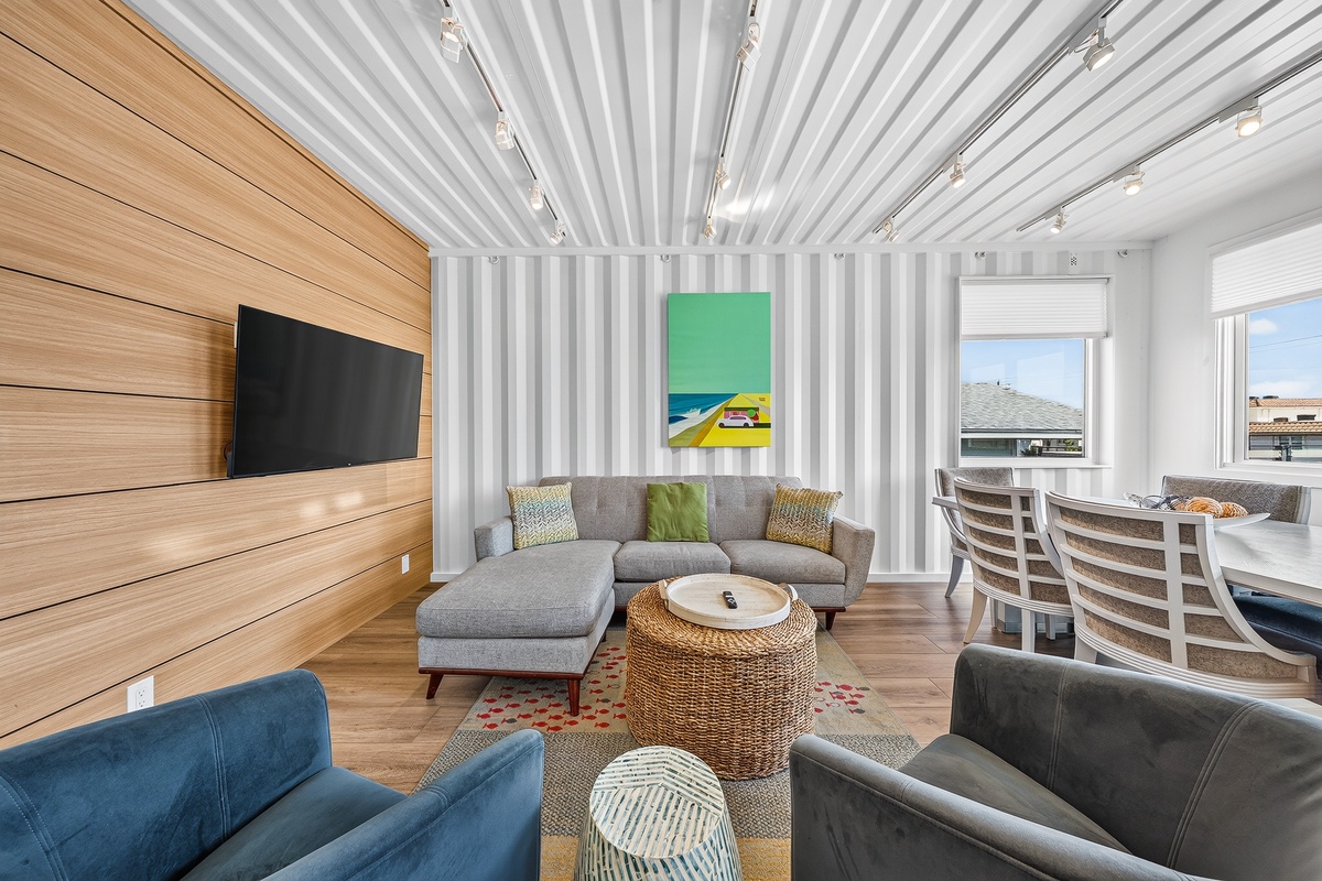 Kick back in this bright living space where coastal vibes meet modern comfort. Soft textures, ocean-inspired accents, and plenty of natural light create the perfect backdrop for your beach getaway.