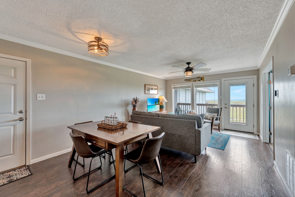 Relax in your open-concept living space with stylish dining area and comfortable seating, leading to your private balcony with peaceful views.