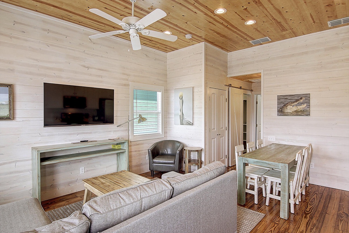 Unwind in this charming cottage with rustic wood accents, cozy seating, and modern amenities perfectly blended for your comfort.