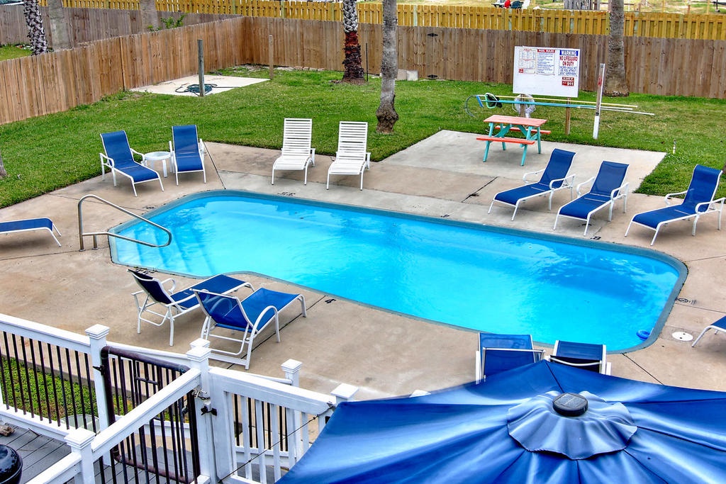 Dive into relaxation at your private pool oasis, complete with lounge chairs and umbrellas for perfect sunny days.