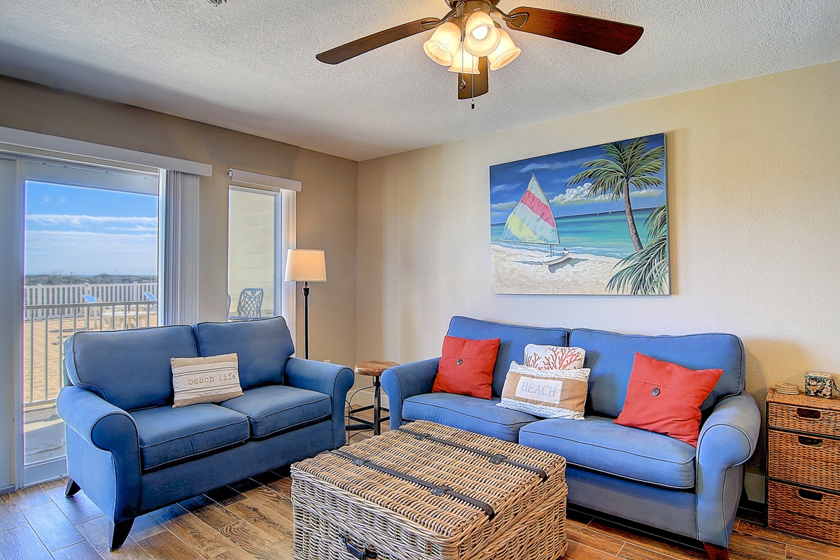 Relax in your coastal living room with ocean-themed decor and comfortable seating for the perfect beach getaway.