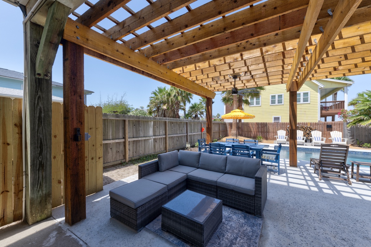 Relax under your private pergola with plush seating overlooking the sparkling pool - your perfect shaded retreat for poolside lounging and entertaining.