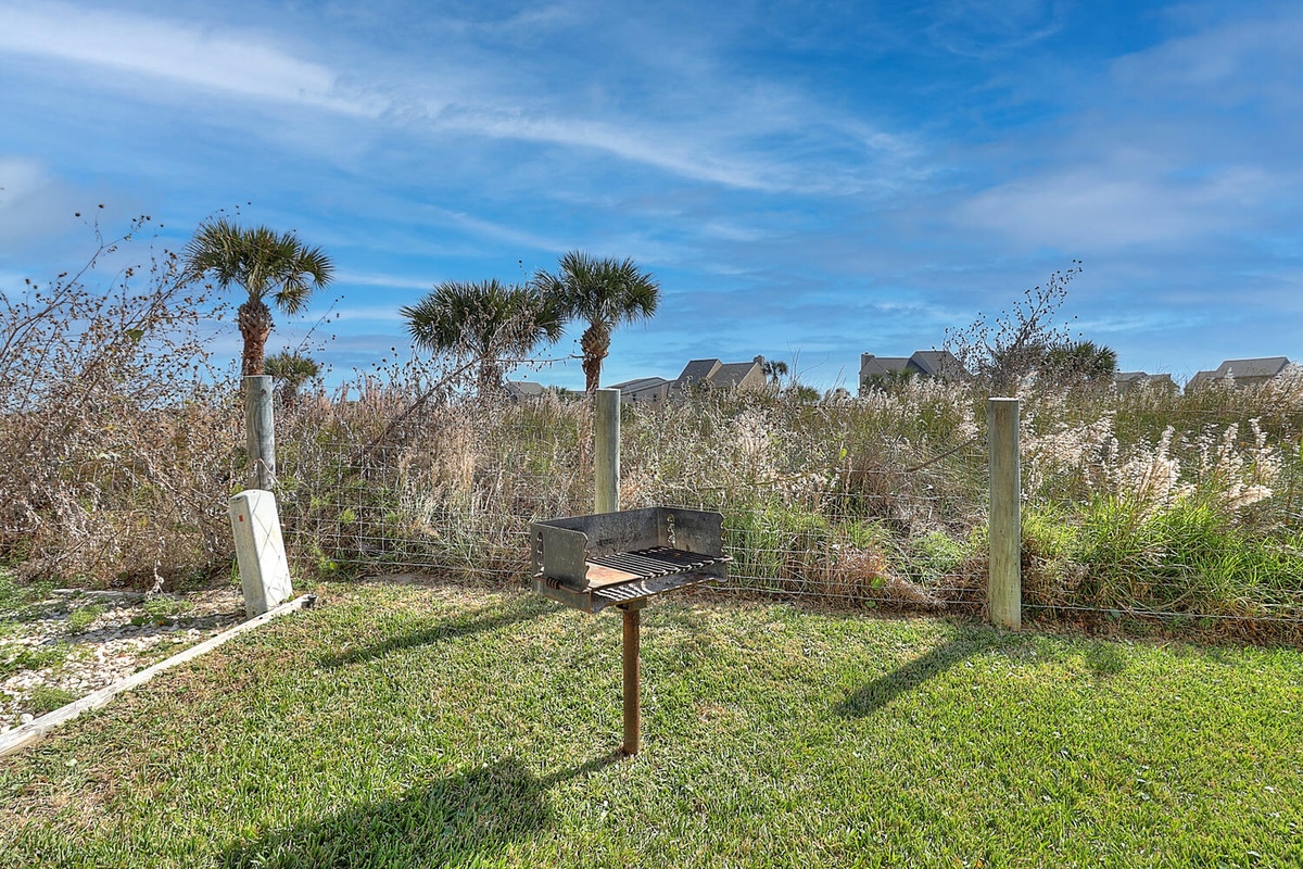 Fire up the grill and savor coastal flavors in your private outdoor cooking area, surrounded by swaying palms and natural dunes.