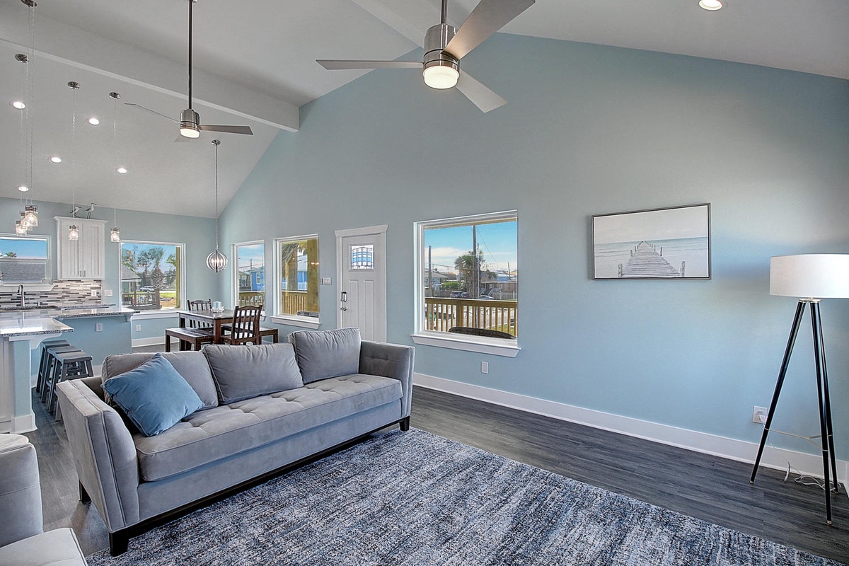 Relax in your bright open living space with vaulted ceilings, cooling fans, and ocean breezes flowing through.