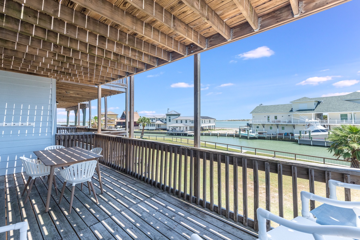 Relax on your private covered deck with waterfront views, where morning coffee tastes better surrounded by coastal charm and gentle breezes.