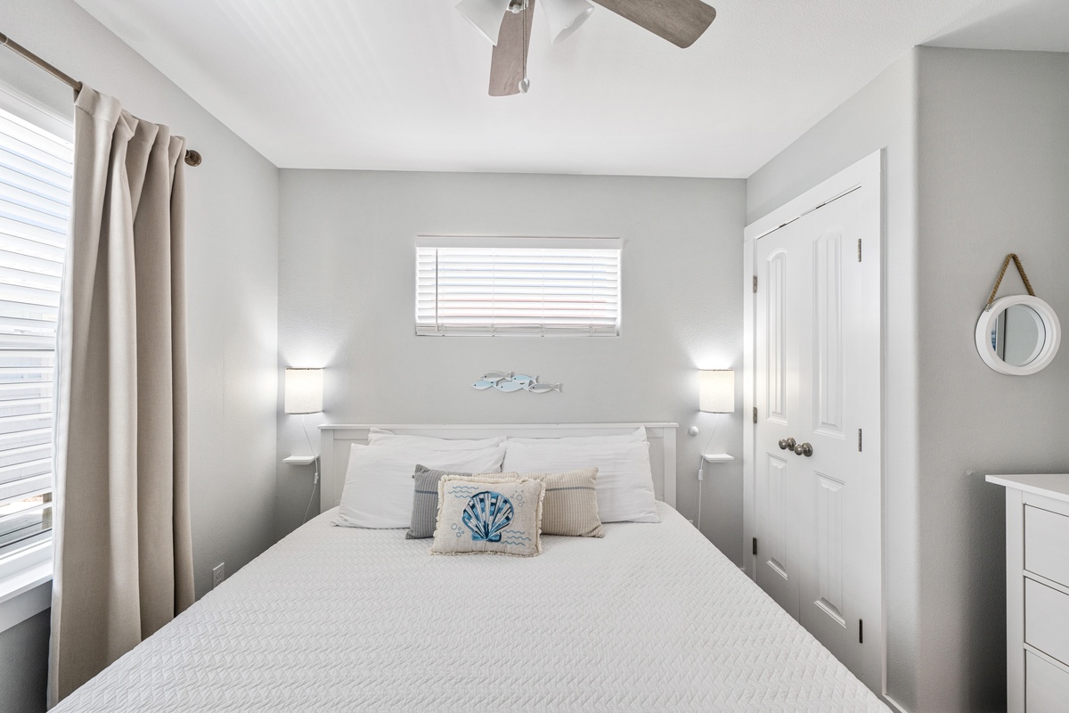 Slip into your serene coastal retreat, where soft linens and gentle lighting create the perfect escape for restful nights by the beach.