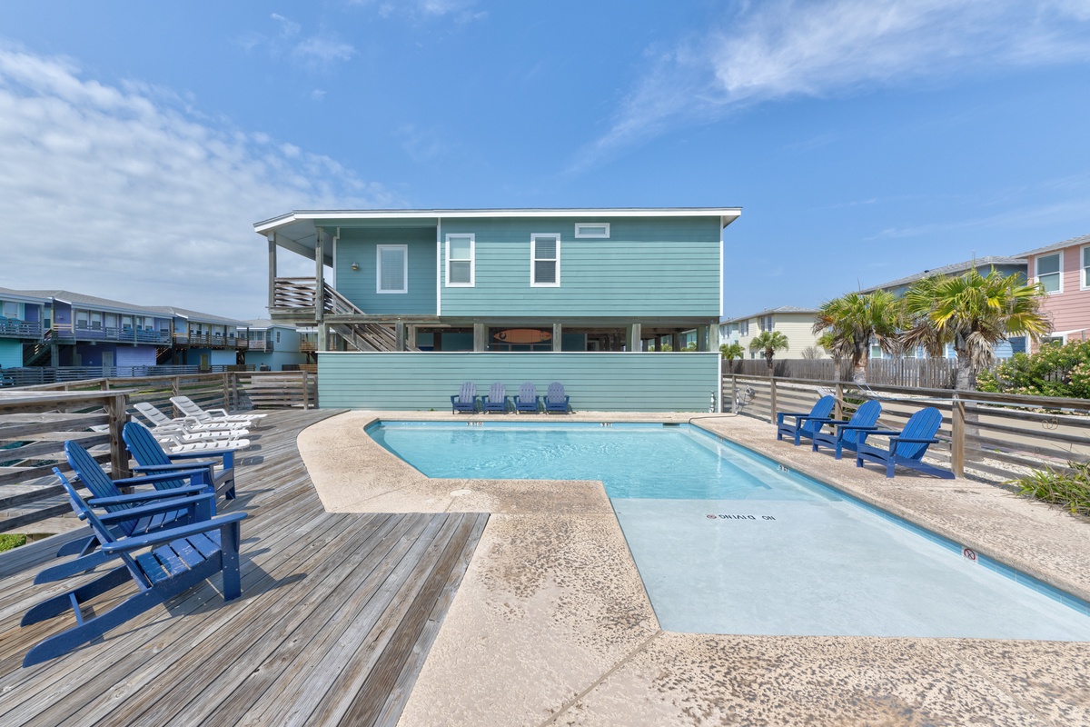 Bright coastal home with a refreshing pool and sun-soaked deck, where beach days blend into poolside evenings. Grab a lounge chair or one of the Adirondack seats and soak in the laid-back, salty air of this seaside retreat.