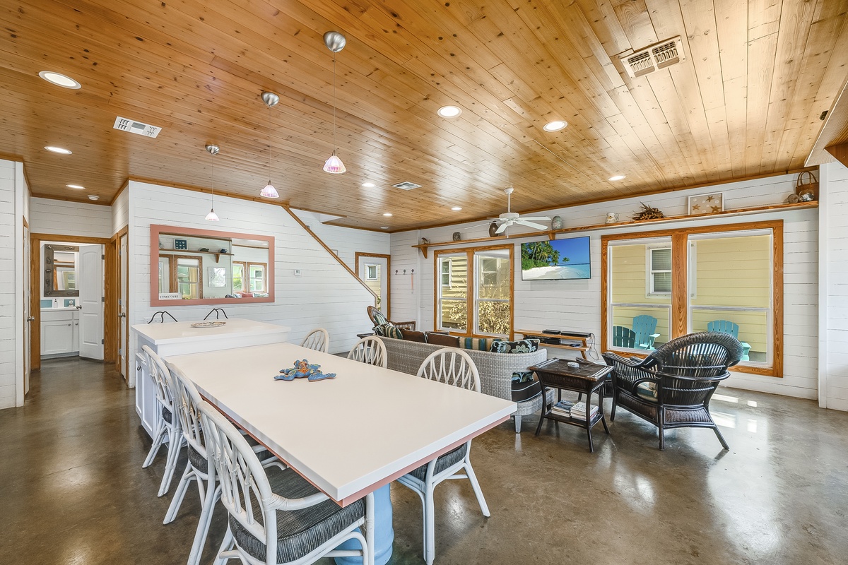Your open-plan kitchen and dining space features beautiful wood ceiling beams and modern appliances for memorable meals together.