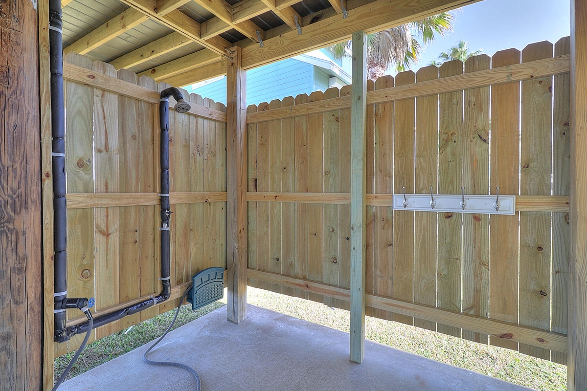 Your private outdoor shower awaits, surrounded by bamboo fencing for complete privacy while you refresh under the open sky.