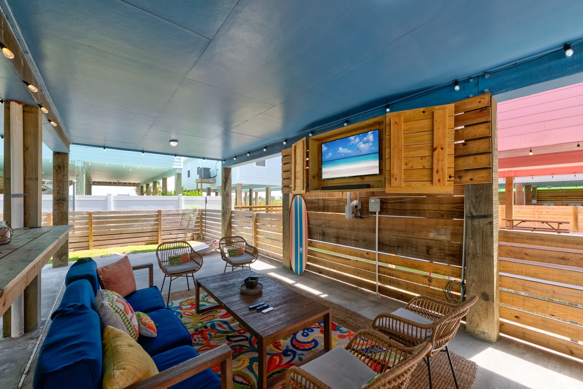 Settle into your private covered patio where coastal charm meets comfort. Sink into the plush seating, breathe in the fresh air, and enjoy your own outdoor living space designed for pure relaxation.