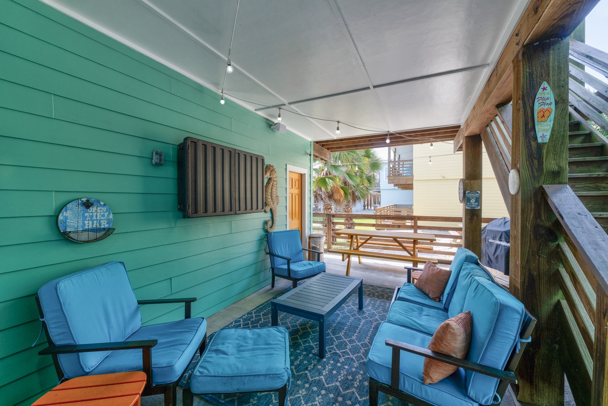 Unwind in your private covered patio with coastal-inspired décor and comfortable seating—perfect for sipping morning coffee or evening cocktails in the sea breeze.