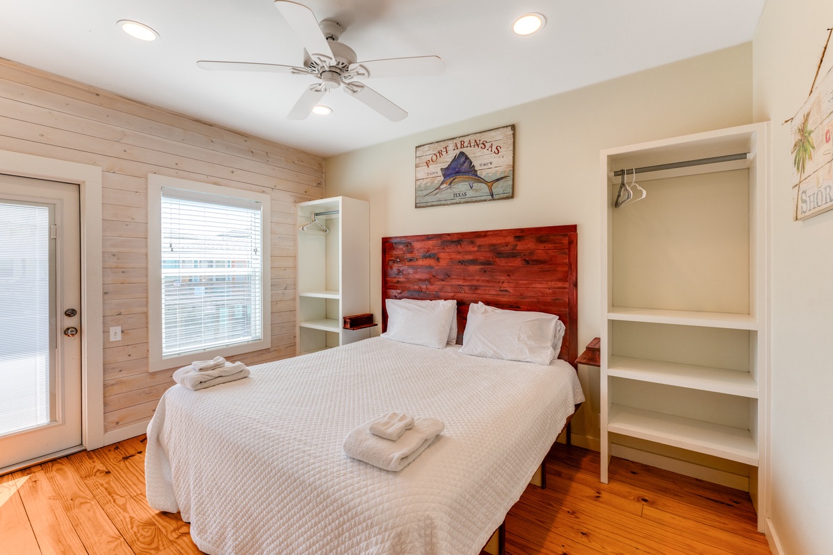 Drift off to sleep in this cozy bedroom with warm wood accents, crisp linens, and thoughtful touches that make your getaway feel like home.