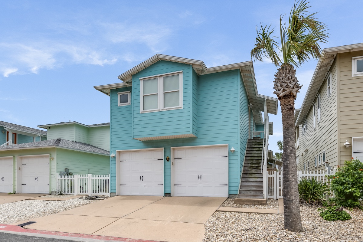 Palm trees, vibrant coastal architecture, and a quiet neighborhood create the perfect setting for your island escape.