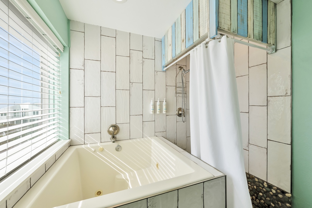 Soak in your private jetted tub or refresh in the tiled shower, all bathed in natural light.