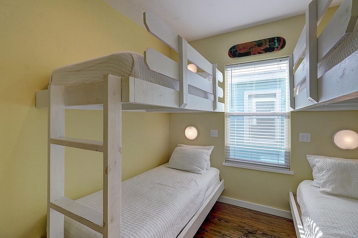 Rest comfortably in your bright shared room with individual reading lights and fresh linens on every bunk.