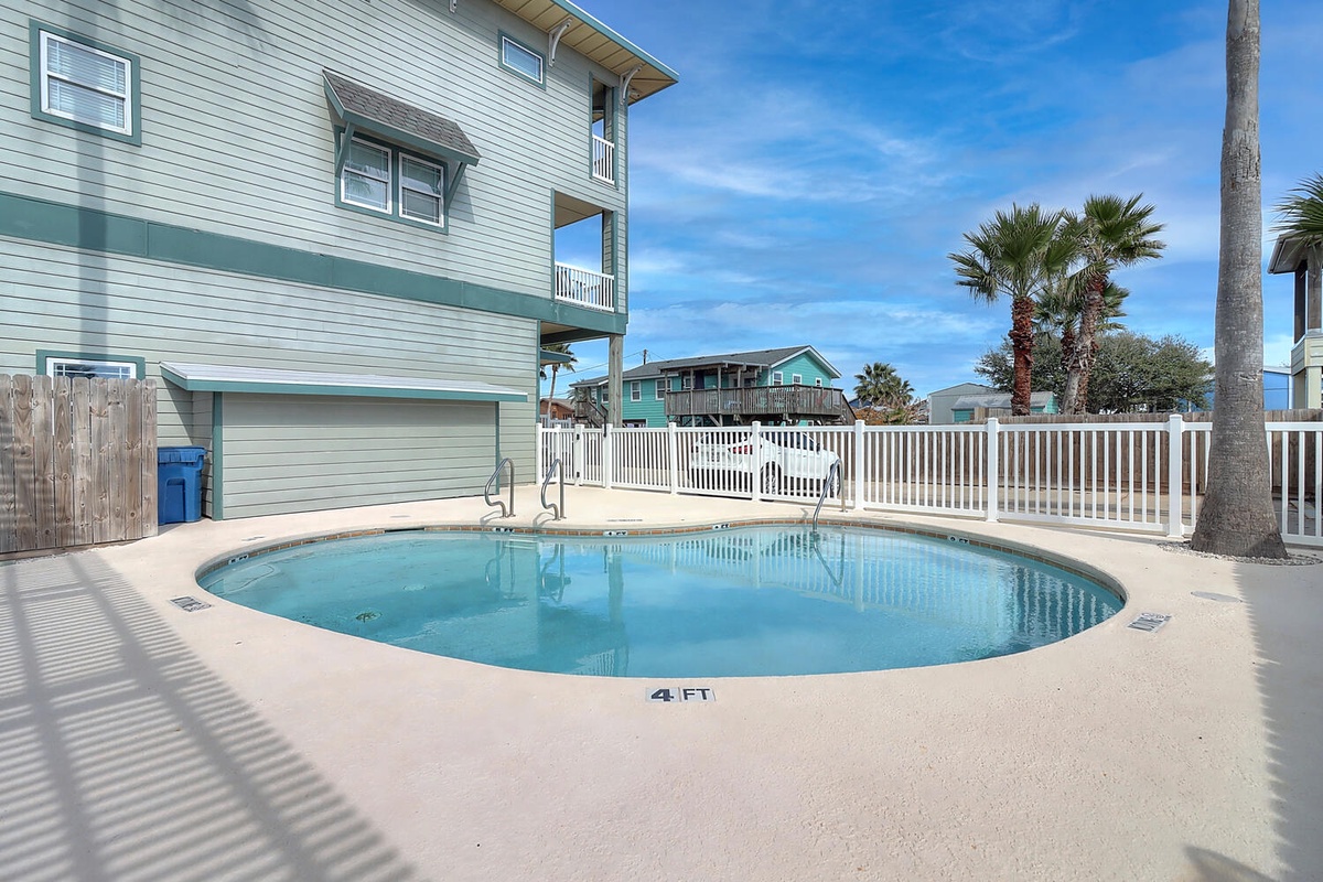 Your private oasis awaits with this inviting pool, perfect for cooling off after sunny beach days in this tropical paradise.
