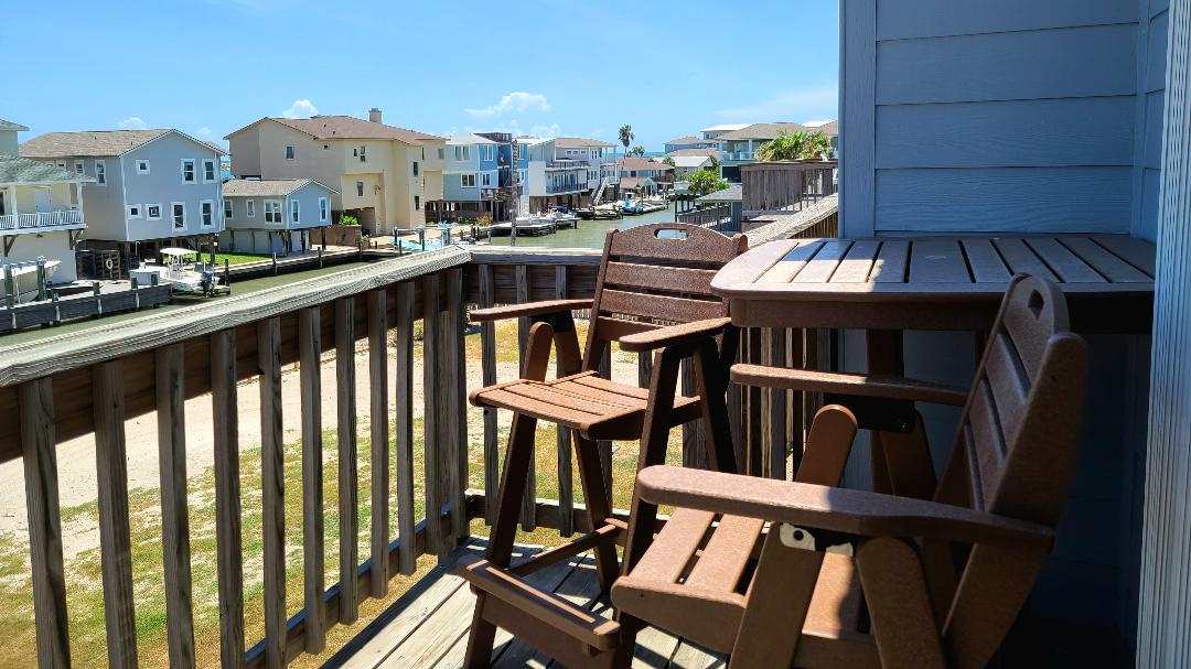 Relax in your private wooden Adirondack chairs on the deck, soaking up warm sunshine while enjoying peaceful neighborhood views.