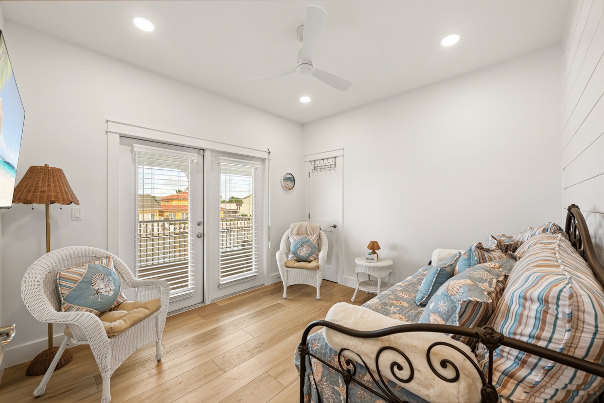 Drift off in this coastal-inspired bedroom, where soft blues and warm wood floors create your peaceful retreat. French doors open to your private outdoor space.