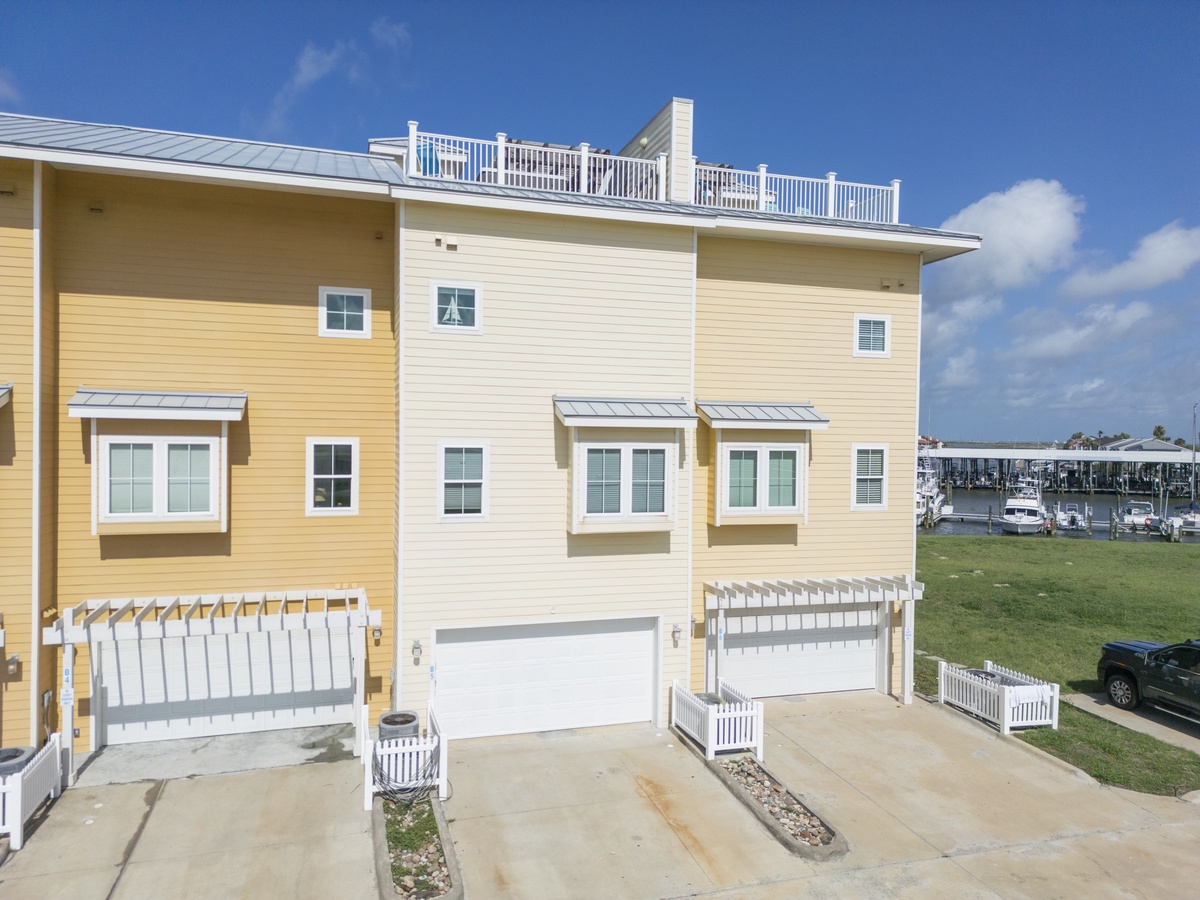 Modern waterfront townhomes with marina access create the perfect coastal retreat for your next vacation getaway.