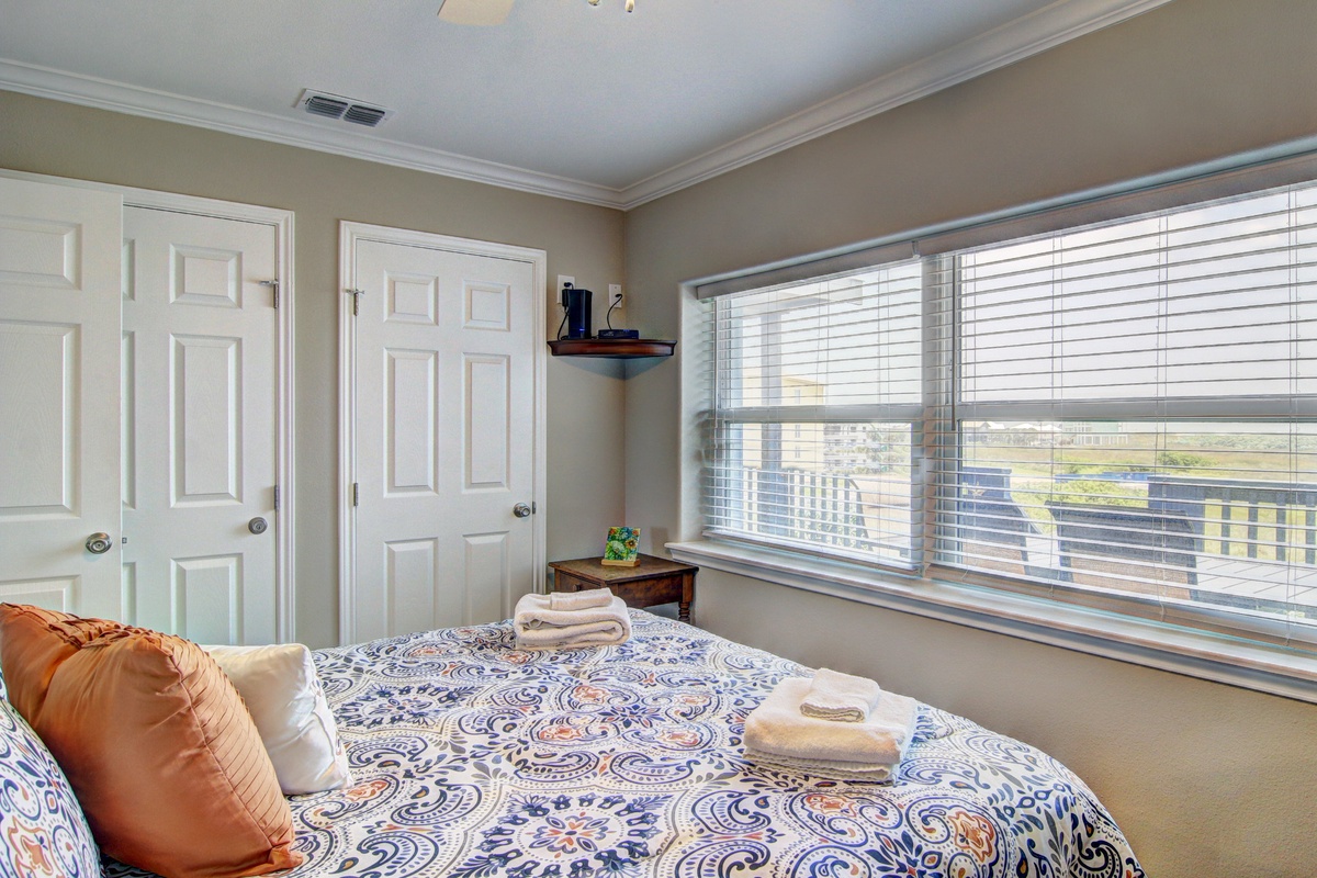 Wake up to beautiful city views through large windows, where fresh linens and thoughtful touches create your perfect retreat.