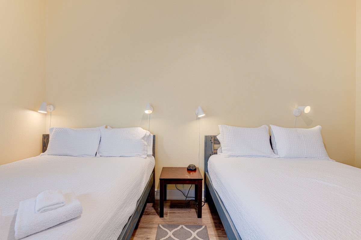 Settle into your cozy twin bedroom with crisp linens, warm reading lights, and thoughtful touches for a restful night.