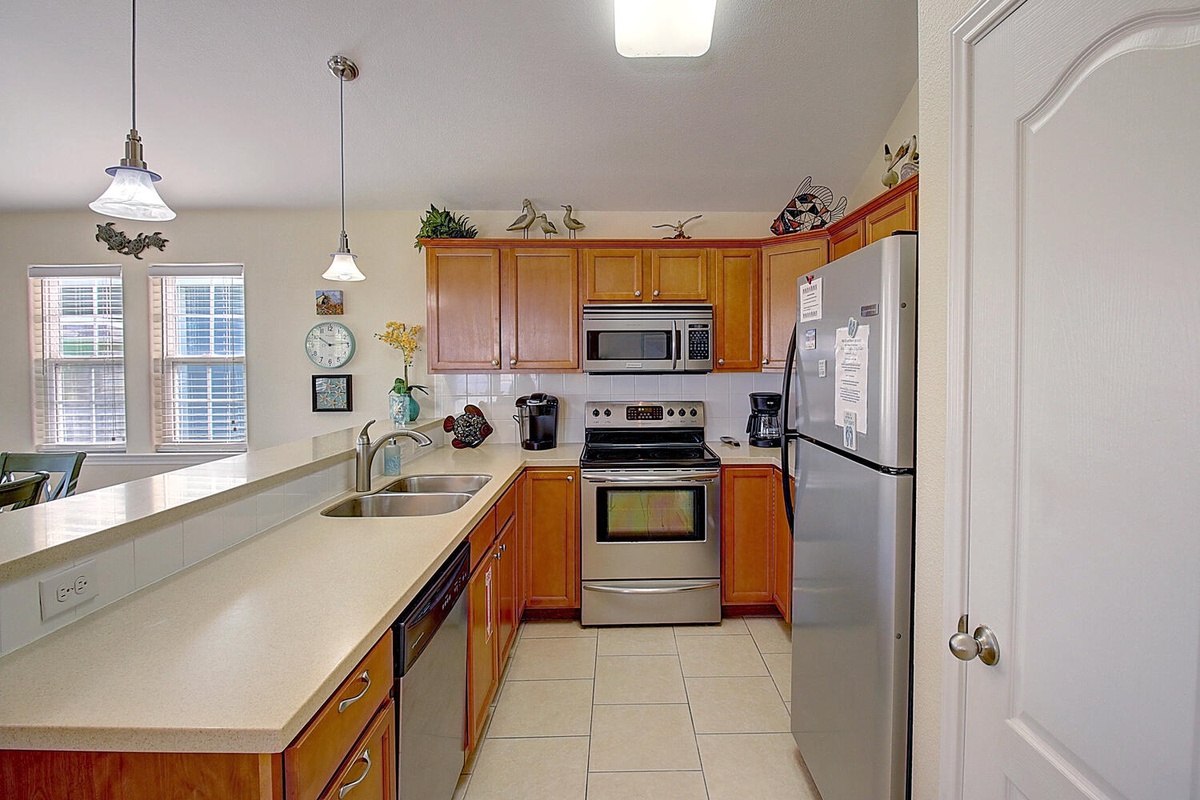 Cook your favorite meals in this fully-equipped kitchen with stainless steel appliances, ample counter space, and everything you need for a comfortable stay.