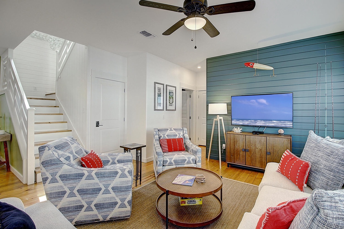 Unwind in your coastal-themed living space with nautical touches, comfortable seating, and ocean views on the big screen.