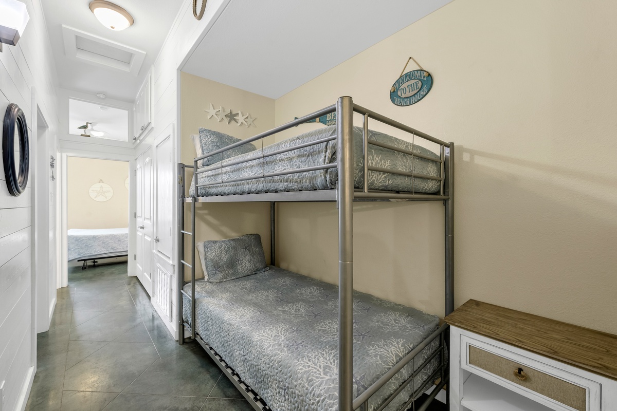 Your kids will love this cozy bunk bed room with nautical touches, perfect for creating vacation memories together.