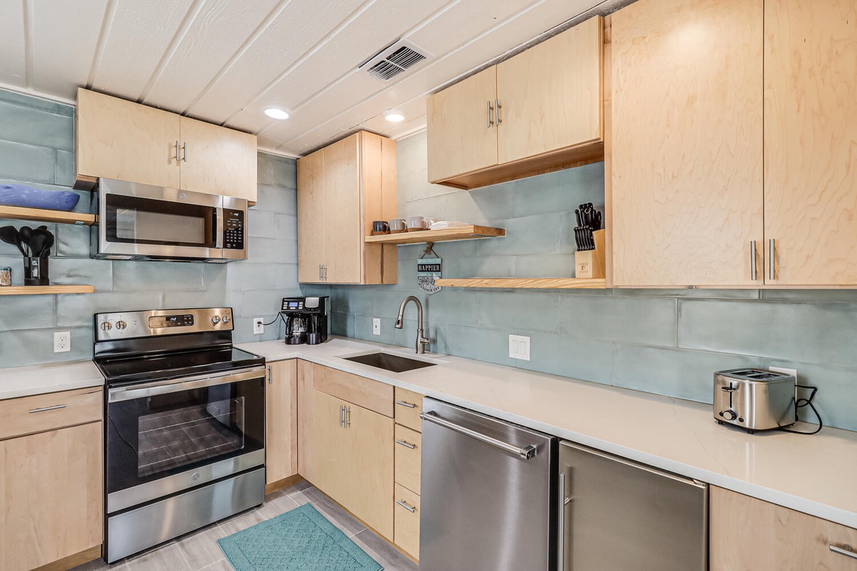 Your modern kitchen features sleek stainless steel appliances and warm wood cabinetry for cooking memorable meals during your stay.