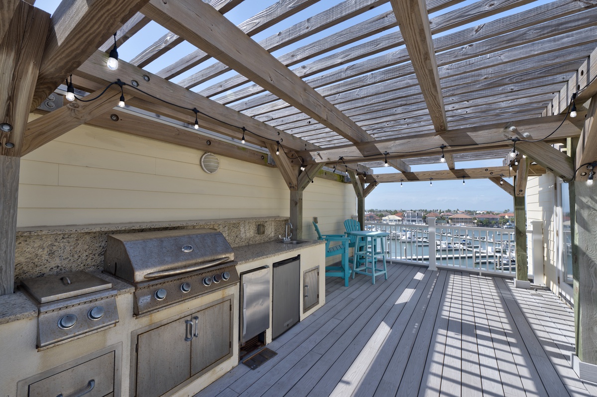 Fire up your favorite meals on this waterfront deck with granite countertops and marina views for magical outdoor dining.