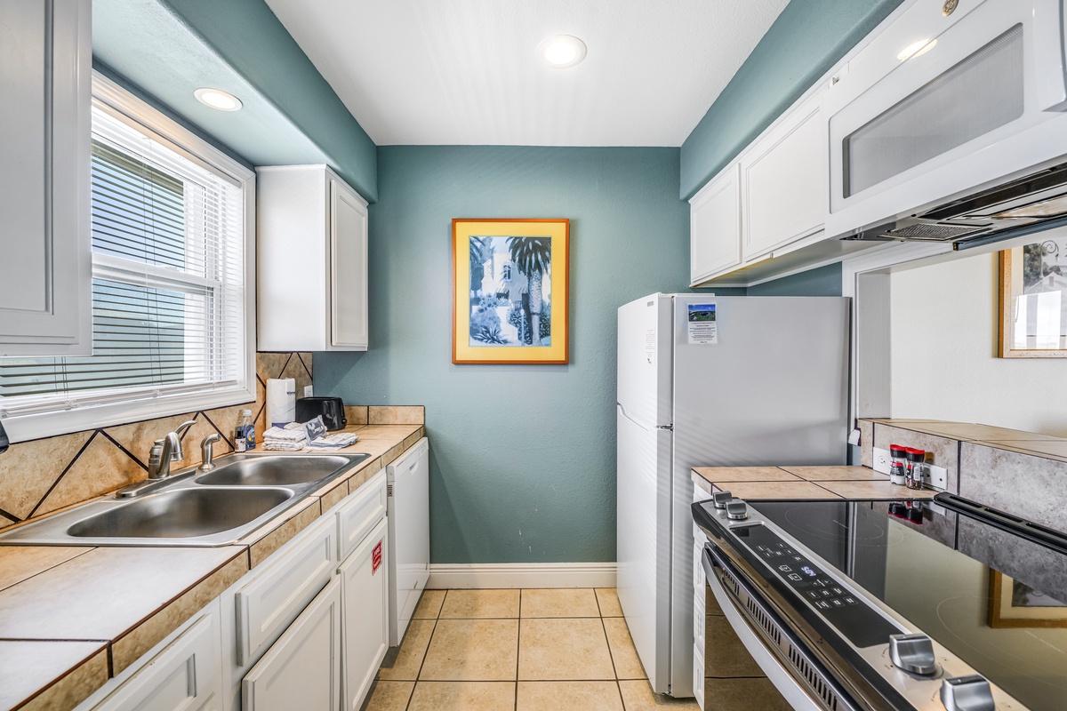 Your fully equipped kitchen features modern appliances and ample counter space for preparing meals during your stay.