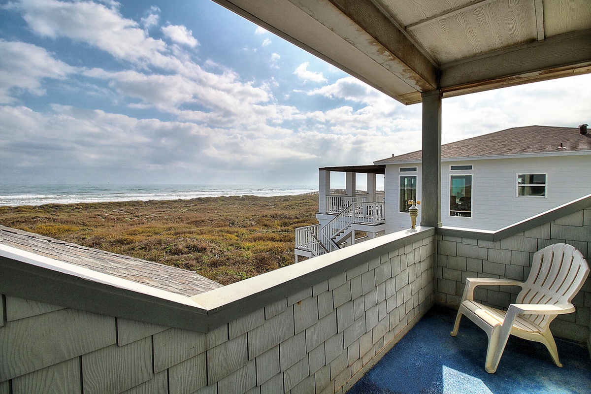 Beachfront property with direct beach access and stunning coastal views from multiple levels.