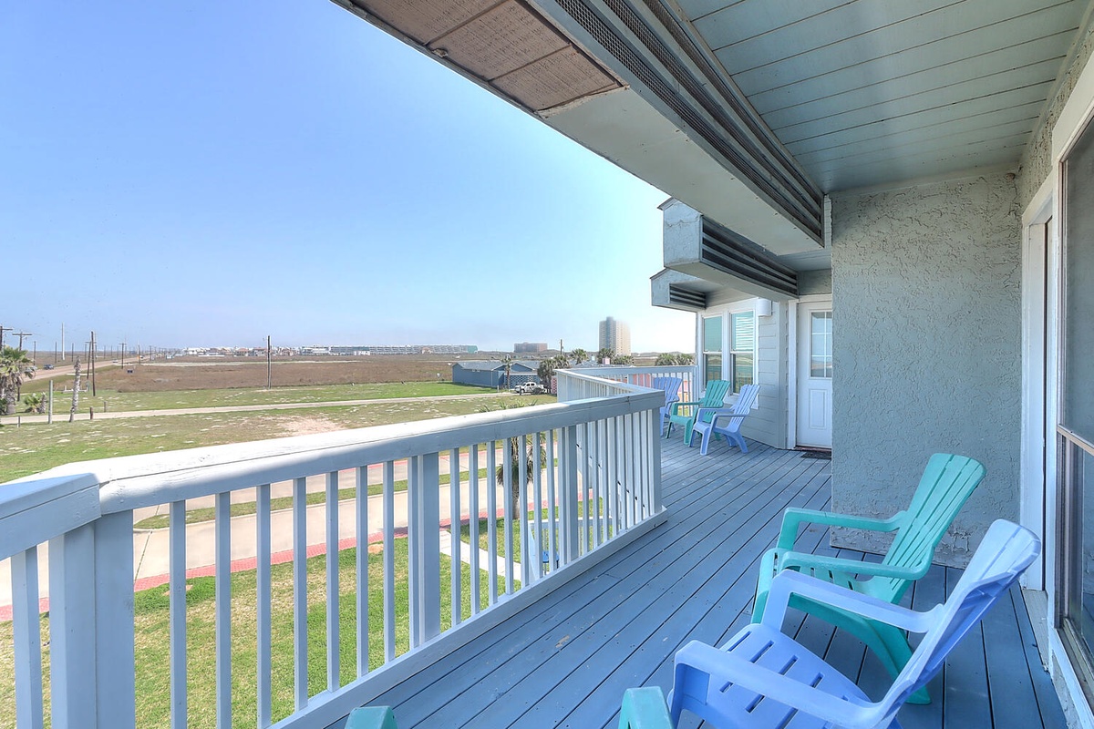 Unwind on your private deck with colorful Adirondack chairs, where you'll enjoy sweeping views of open fields and distant city lights.