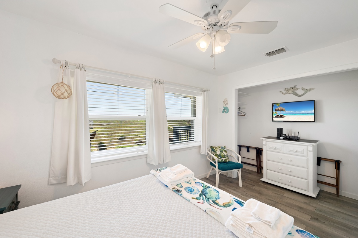 Wake up to sweeping coastal vistas from your bright and peaceful bedroom, where gentle breezes drift through the windows and natural light fills the space.