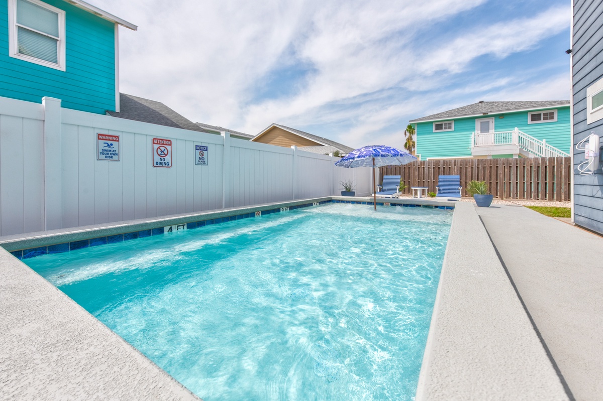Dive into your private oasis with crystal-clear waters perfect for morning swims or afternoon relaxation under the coastal sky.