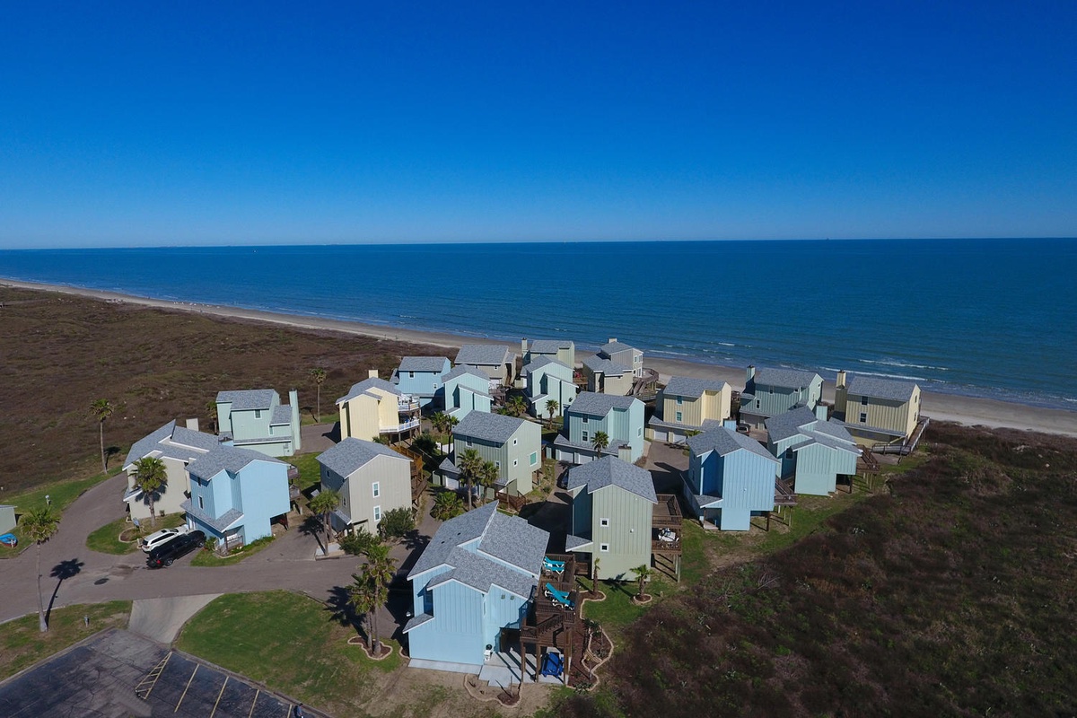 Charming beachfront community with direct ocean access and pristine sandy shores.