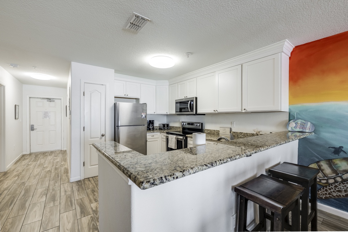 Your fully equipped kitchen features granite countertops, stainless-steel appliances, and breakfast bar seating—perfect for cooking and gathering with loved ones.