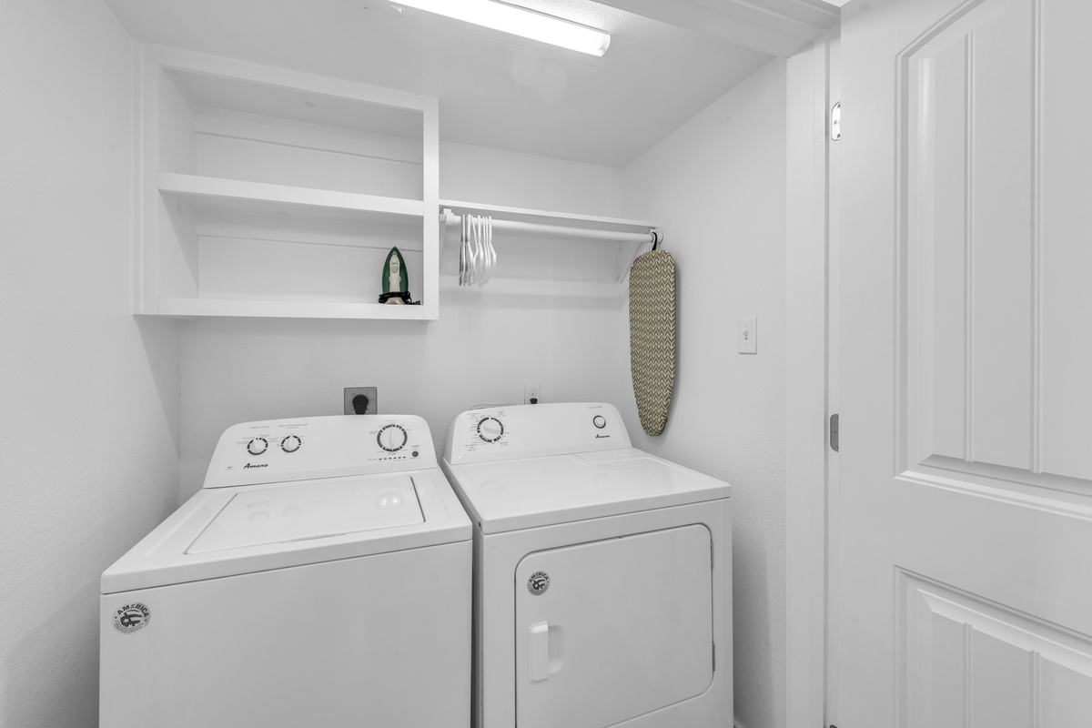 Your bright laundry room keeps your clothes fresh with a washer, dryer, and built-in storage for all your travel essentials.