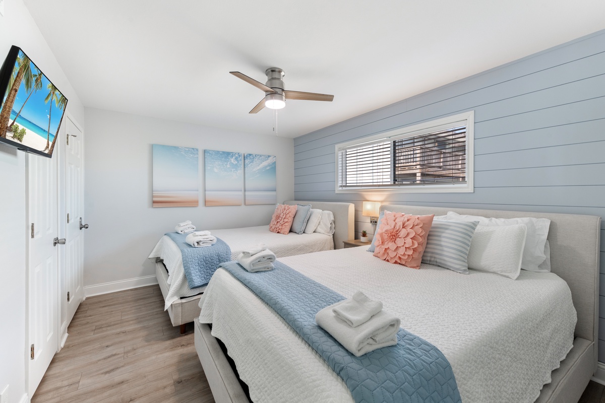 Your serene twin bedroom features coastal-themed décor, soft linens, and thoughtful touches that invite peaceful nights by the sea.