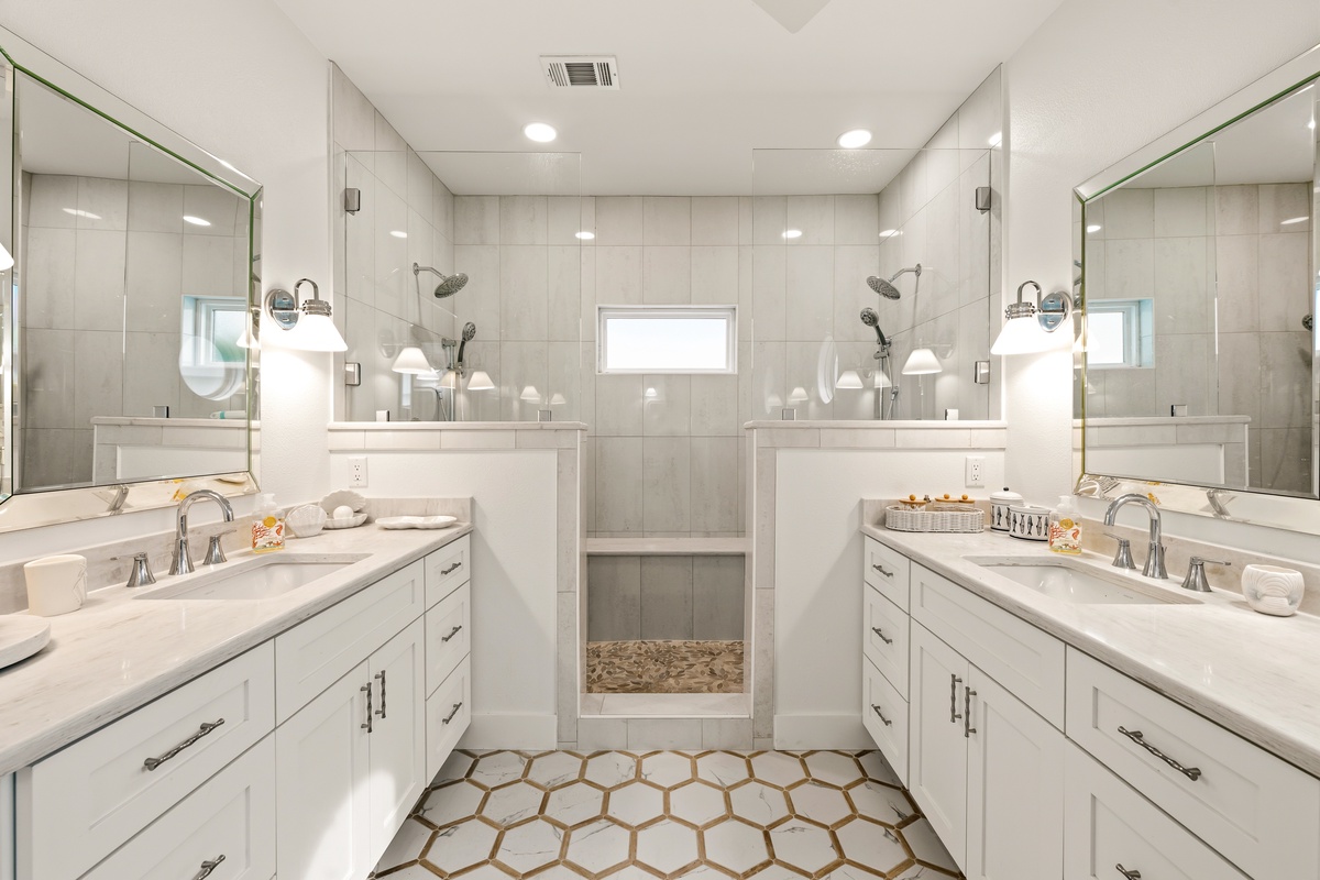 Your ensuite awaits with dual vanities, gleaming marble counters, and a private walk-through shower with dual rainfall heads—a spa-like retreat designed just for you.