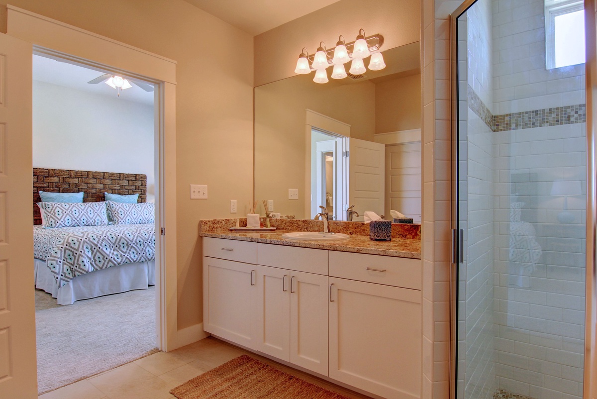 Your private master suite bathroom features elegant granite countertops, spacious vanity storage, and a beautiful walk-in shower for relaxing mornings.