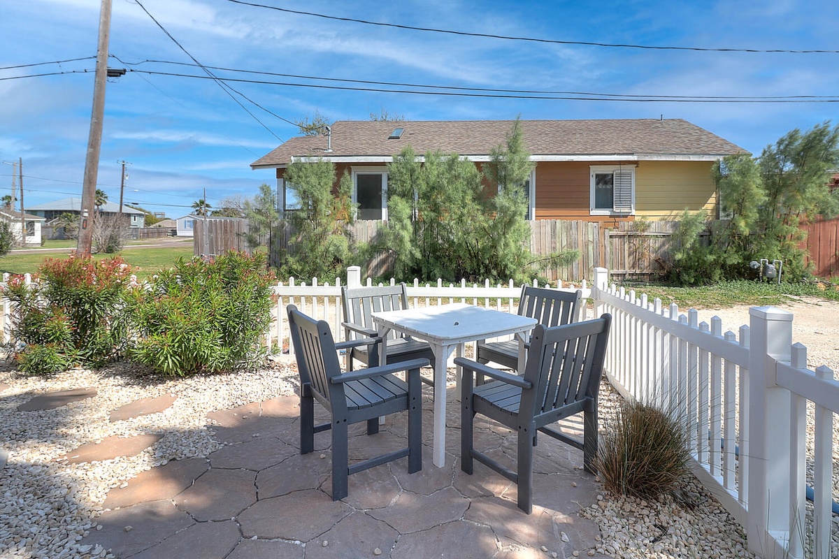 Enjoy your morning coffee at your private patio table, surrounded by desert landscaping and charming neighborhood views.