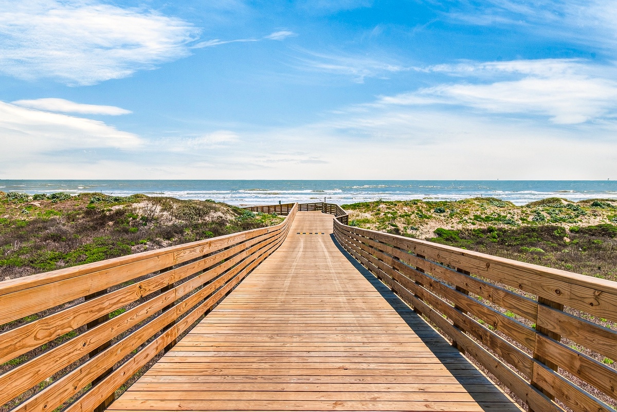 Scenic boardwalk through the coastal dunes with convenient golf cart access to the beach and the best of Port Aransas.
