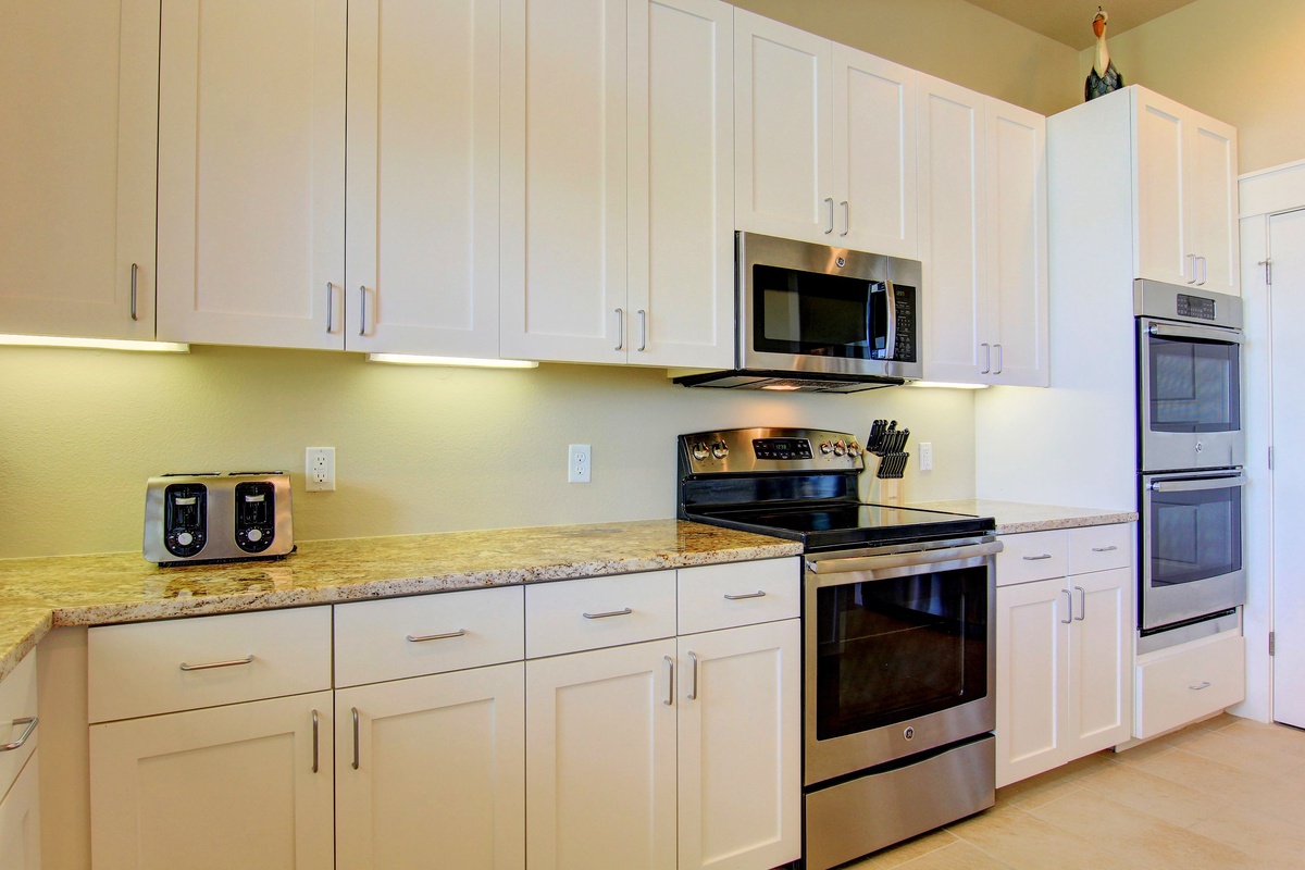 Your fully equipped kitchen features granite counters, stainless appliances, and under-cabinet lighting for effortless meal preparation.