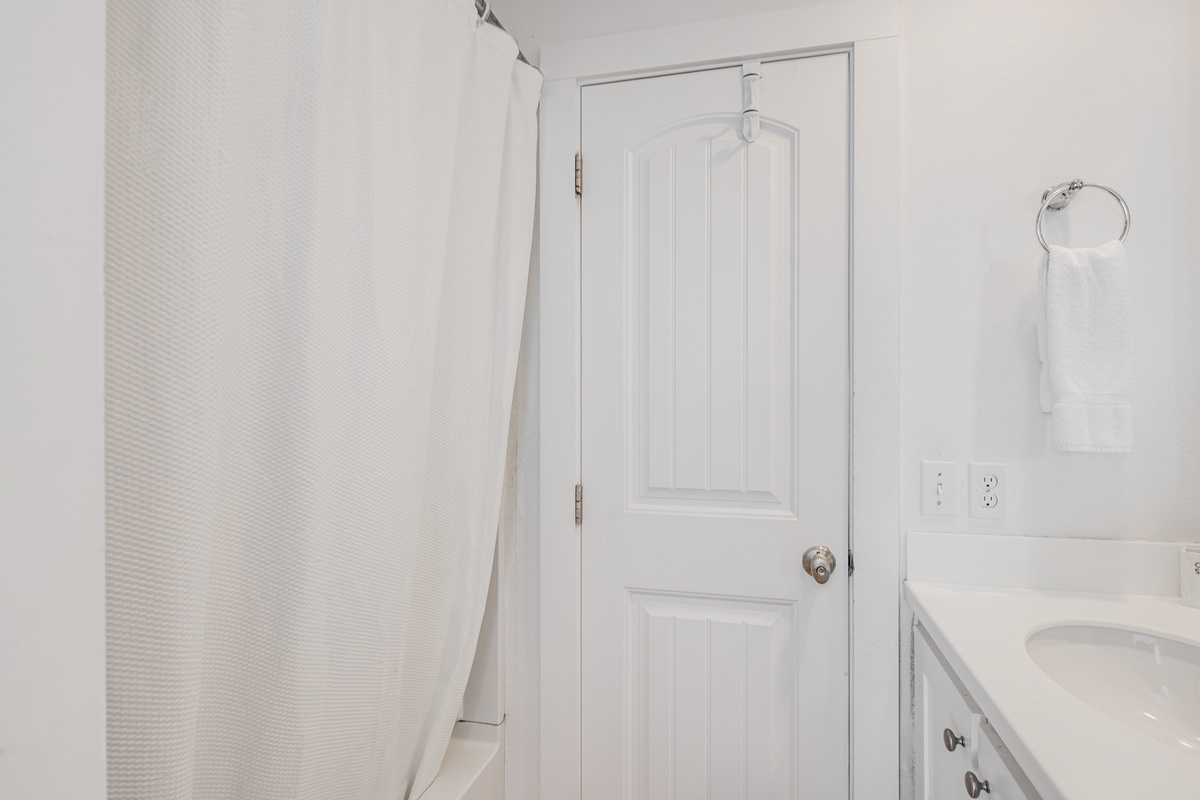 Step into your pristine private bathroom with crisp white finishes and soft towels waiting for your arrival.