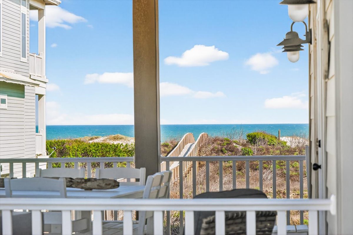 Beautiful ocean views and beach access from this coastal property's covered terrace area.