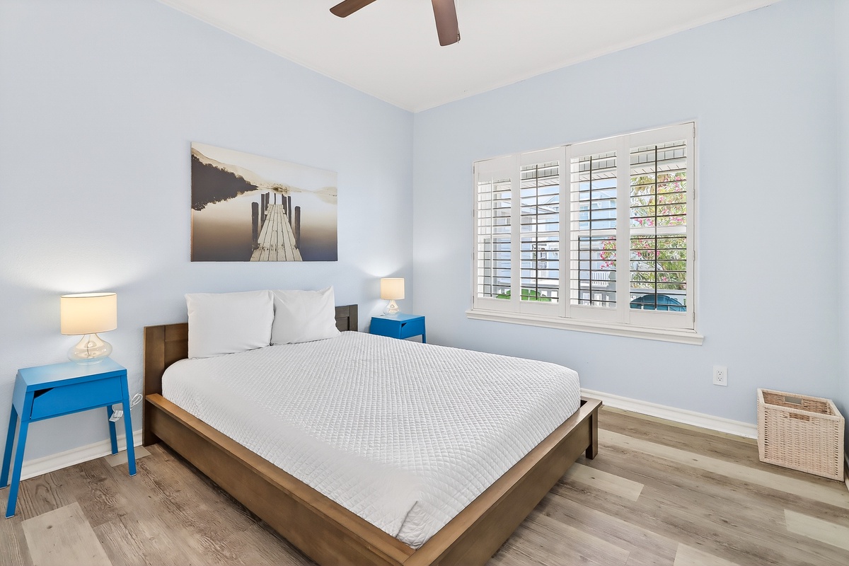 Drift into peaceful sleep in your bright, airy bedroom with crisp linens and gentle natural light filtering through plantation shutters.