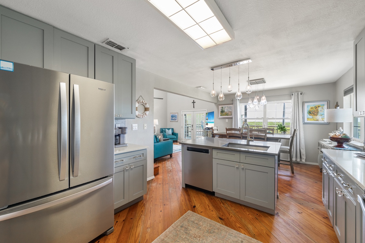 Prepare your favorite meals in this beautifully appointed kitchen, flooded with natural light and designed for both function and comfort, with modern appliances and ample counter space for all your culinary adventures.