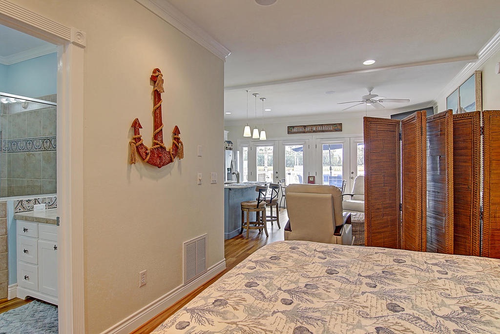 Relax in your coastal retreat where nautical charm meets modern comfort, complete with an open layout flowing to your private bathroom.
